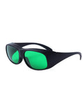 Badass Red Laser Protective Glasses With Heavy Duty OD6 Plus Optical Density Coverage For 620 To 700 Nm Wavelengths And Premium Clear Lens Safety Optics For Workshops And Labs, with green lenses and black frame, angled view.