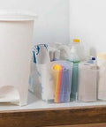 Slick 12 Quart Clear Storage Bins With Built In Carry Handles Narrow Rectangular Organizer Containers For Pantry Closet Cabinet Shelf And Home Organization Straight Up Durable Two Pack filled with cleaning supplies.
