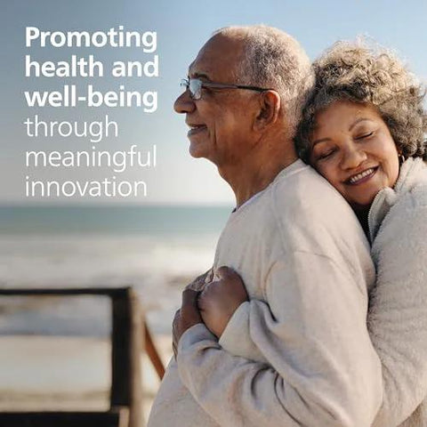 AED defibrillator promo image: two people embracing on a beach with promotional text overlay; no device visible.