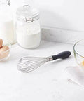 Stainless Steel Balloon Whisk Set 3 Piece With 9 Inch 10 Inch And 11.5 Inch Sizes Easy Grip Ergonomic Handle in a kitchen setting