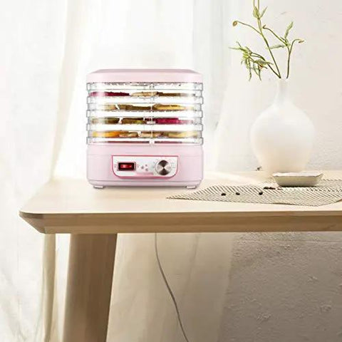 Smooth Operator Electric Food Dehydrator Machine With Five Adjustable Trays And Digital Timer on wooden table with dried fruits.