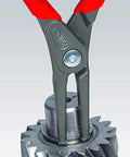 Knipex 00 20 01 V02 Circlip Snap Ring Pliers Set removing snap ring from machinery part close-up