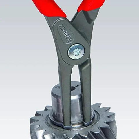 Knipex 00 20 01 V02 Circlip Snap Ring Pliers Set removing snap ring from machinery part close-up