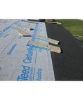 Top Shelf Synthetic Roof Underlayment Roll Heavy Duty Water Blocked Roofing Felt Alternative With Tough Woven Core on rooftop.