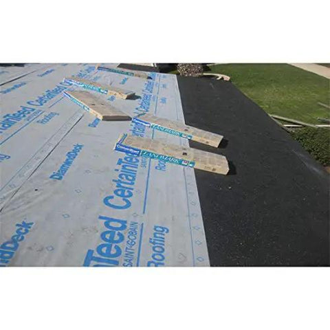 Top Shelf Synthetic Roof Underlayment Roll Heavy Duty Water Blocked Roofing Felt Alternative With Tough Woven Core on rooftop.