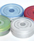 Four empty 10ml glass vials with aluminum flip-off caps in blue, green, white, and red
