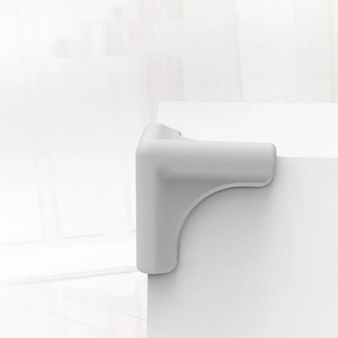 Silicone Corner Guard 8 Pack Protects Table Edges From Bumps And Collisions on white table, kid safe and pet friendly
