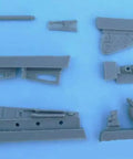 1/32 Focke-Wulf FW 190 D-9 Tail Wheel Detail Set, Resin 7-Piece Upgrade for Hasegawa Aircraft Kits arranged on blue surface