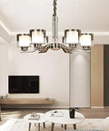 Slick Nickel Four Bulb Led Pendant Chandelier Casts Pure 5500k White Light To Instantly Level Up Your Living Room Dining Setup With Smooth Modern Vibes Today, featuring a sleek metal frame and four light sockets.