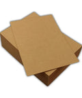 Ten Pack 8.5 By 11 Inch Chipboard Sheets For Crafting, Scrapbooking, Mounting, Backing, Framing, Packaging And Shipping Protection, 0.022 Inch Thick Cardboard Boards For Everyday DIY Projects. Two brown chipboard sheets stacked on box.