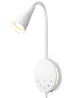 Total Game Changer Led Wall Mount Reading Lamp With Touch Panel And Five Dimmer Settings For Peak Cozy Vibes Includes Usb Charge Port Smart Night Timer And Flexible Gooseneck Design In Clean White mounted on the wall with an adjustable neck.
