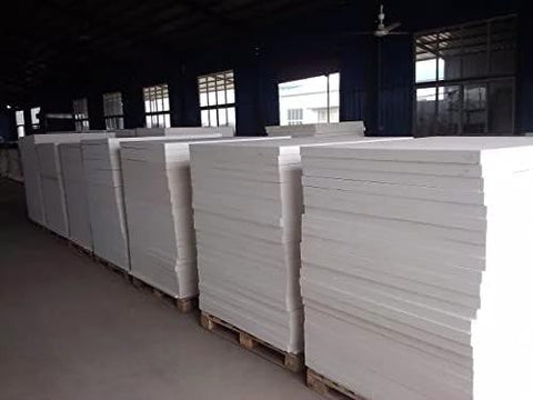 Ceramic fiber insulation board, 24x12x1 in, white; several boards stacked on pallets in a warehouse