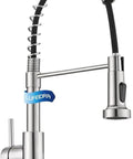 Kitchen Faucet in brushed nickel finish with a pull-down sprayer and flexible coil design for easy use.