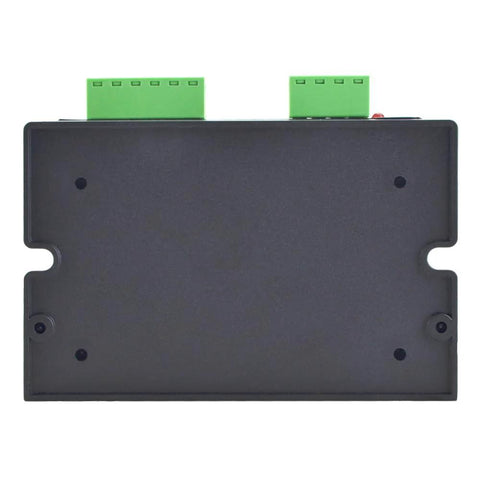 Stepper motor driver module in black housing with two green terminal blocks on top.