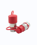 Two red 3/4 in NPT skid-steer hydraulic quick-connect couplers with dust caps
