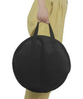 Hella Tough Octopus Practice Pad Storage Bag For 10 Inch Dumb Drum Slick Oxford Cloth being carried, black, round, durable design.