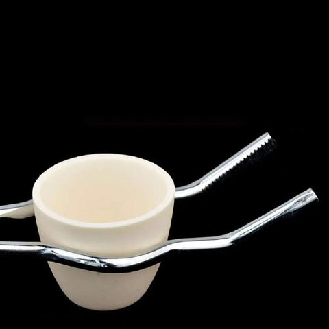 8 Inch Stainless Steel Crucible Tongs Pro Grade Lab Tool gripping a crucible with anti-rust and anti-corrosion grip visible