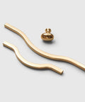 Golden Wave Shaped Cabinet Pulls Set Of 6 With Glossy Cupboard Drawer Knobs in gold aluminum, wave style on white background.