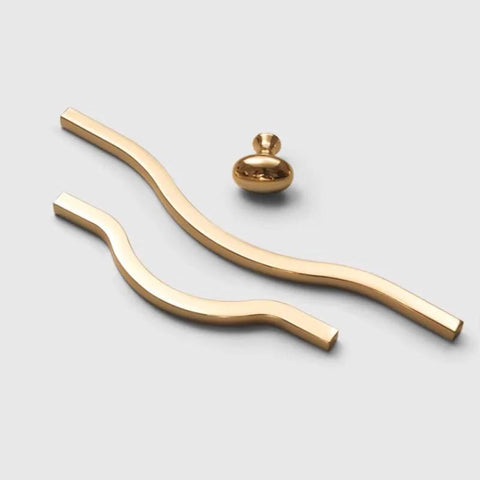 Golden Wave Shaped Cabinet Pulls Set Of 6 With Glossy Cupboard Drawer Knobs in gold aluminum, wave style on white background.