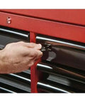 Person using a key to lock the Heavy Duty 16 Drawer Tool Chest And Rolling Cabinet Set 46 Inch Red Black for secure storage.
