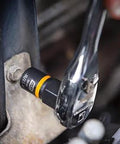 Close-up of Eight Piece Workhorse Quarter Inch And Three Eighths Inch Drive Bolt Biter Impact Extraction Socket Set in use on fastener