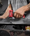 User operating the Top Shelf Brushless Right Angle Die Grinder 12V Cordless Powerhouse on a carbon fiber surface.