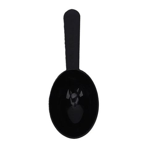 Black plastic coffee scoop designed for Portable Travel Coffee Maker With Built In Grinder 16 Oz Brew Cup.