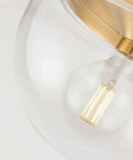 Close-up of Grace 1 Flush Mount Ceiling Light in Aged Brass Finish with Clear Glass, 10 Inch Wide by 7 Inch High, Classic Yet Modern Incandescent