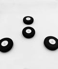 Set of 4 lightweight 2 inch foam RC airplane wheels for DIY model plane, black tires with white hubs, top view