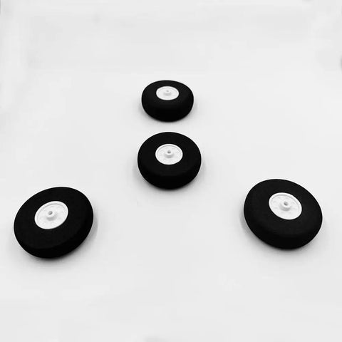 Set of 4 lightweight 2 inch foam RC airplane wheels for DIY model plane, black tires with white hubs, top view