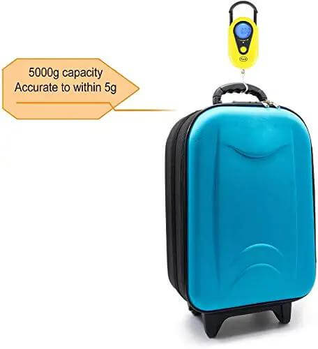 Beefy Hanging Scale With 11 Pound Capacity, LCD Digital Weigh Scale In Bright Yellow weighing a blue suitcase, reads grams or ounces.