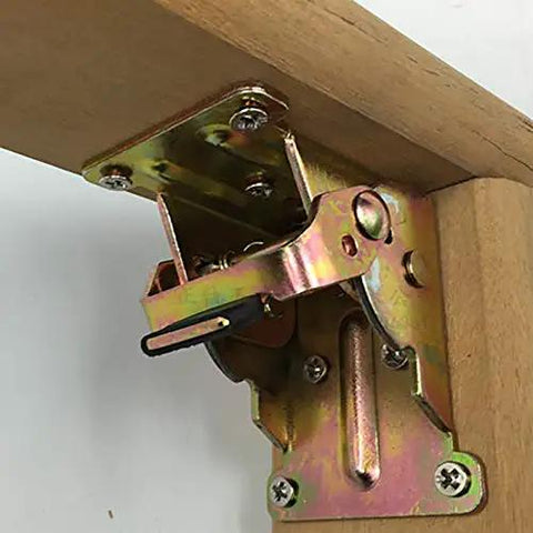 Close-up of mounted iron folding hinge table leg brackets foldable for tables and chairs self locking feet hinges durable iron construction