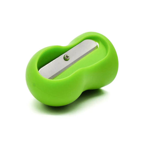 Green handheld vegetable spiral slicer with stainless steel blade, close-up view