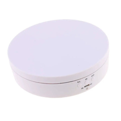 Luxury Electric Rotating Jewelry Display Stand With Mirrored Base, Smooth Spin Turntable For Rings, Necklaces & Watches, ABS Build, High Speed Rotation Showcase Organizer Box top view of the round white ABS base with control buttons.