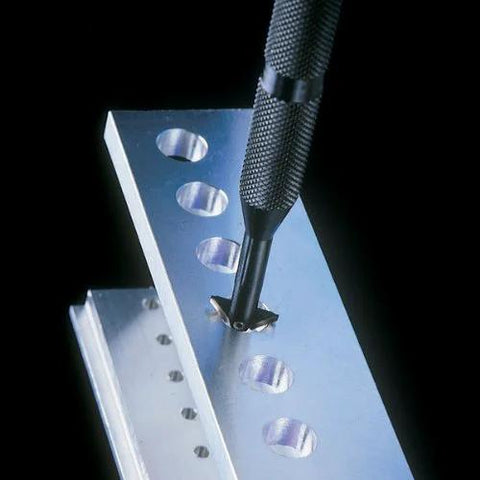 Close-up view of a large metal reversible deburring tool holder with a knurled handle and blade.