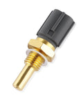 Engine coolant temperature sensor with brass body and gray plastic connector (front view)