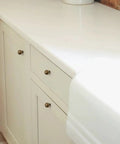 Kitchen cabinet with 10 Pack Antique Brass Cabinet Knobs 0.9 Inch Round Solid Zinc Alloy Vintage Dresser Drawer Pulls installed.
