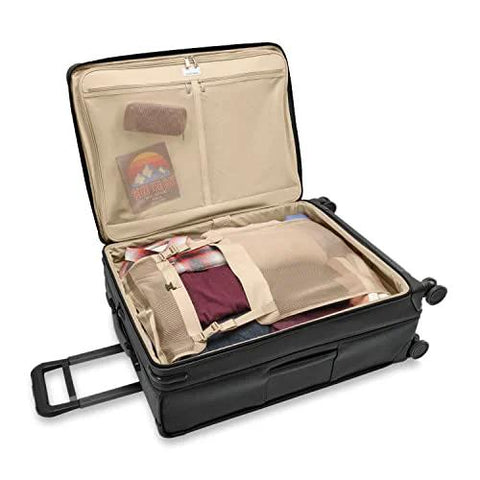Open Briggs & Riley expandable spinner luggage showcasing interior compartments and travel packing features.
