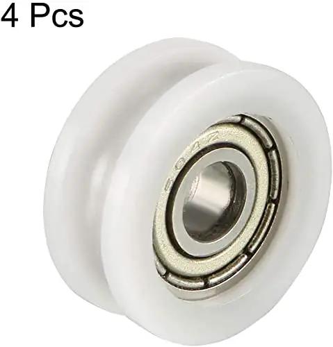 Ready To Roll V Groove Bearing Pulley Wheels For Linear Guide Rails Smooth Slide Track Rollers Heavy Duty Precision Engineered Build Quiet Operation Pack Of Four White close-up of white nylon pulley with sealed bearing.