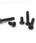 Black flat-head screws from the Miniature Screw Set With 18 Sizes, ideal for DIYers, plumbers, and assembly pros, pictured in close-up.