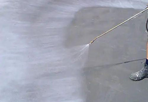 Heavy Duty Water Based Concrete Sealer And Cure Compound Hella Tough For Driveways Patios And Garages delivering knockout dust defense applied by spray.