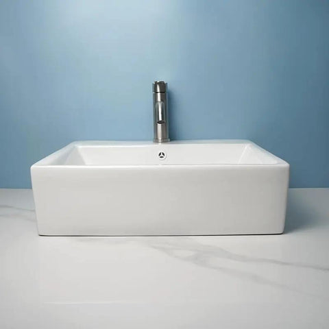 USZWBY Vessel Sinks Bathroom Vessel Sink Simple Ceramic Above-Ground Basin with sleek faucet and blue background.