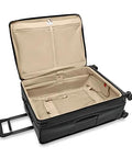 Open black Briggs & Riley expandable spinner luggage with spacious interior and durable four-wheel design.