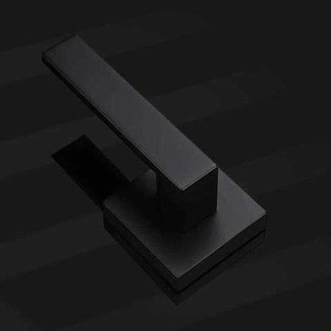 Matte Black Dummy Door Levers Interior Handles For Closets And Pantry Doors, single handle close-up on black surface
