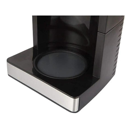 Close-up of a black and silver coffee machine tray