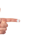 Close-up of a finger holding one of the 200 Pieces White Plastic Self Tapping Screw Cap Covers 7mm Diameter For Cabinets And Furniture Fittings