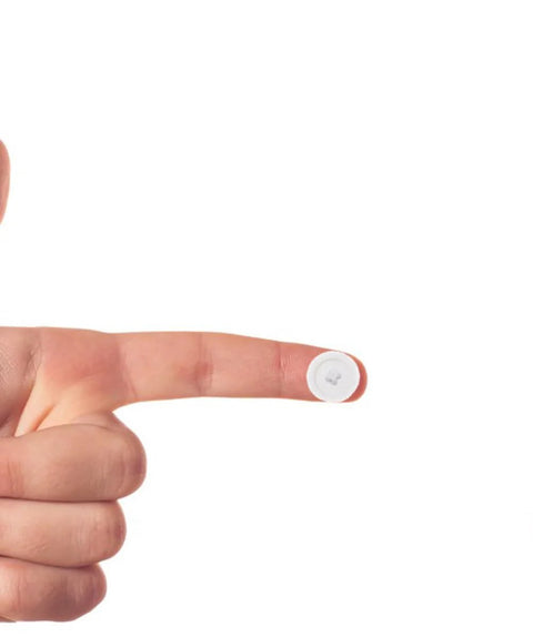 Close-up of a finger holding one of the 200 Pieces White Plastic Self Tapping Screw Cap Covers 7mm Diameter For Cabinets And Furniture Fittings