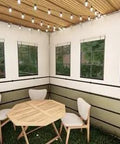 10x12 Ft Deluxe Sukkah Shelter For Sukkot Gatherings With Weatherproof Fabric Walls Bamboo Schach Roof Magnetic Screen Door No Sweat Butter Smooth Quick Setup interior view with seating and lights