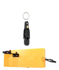 Keproving fishing line release clip, black plastic with O-ring; shown detached and mounted on an orange planer board.