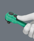 Hand holding Slim 1/4 Inch Drive Ratchet With Reversible Lever, 80-Tooth Gear Delivers Ultra Short 4.5 Degree Return, 144mm length